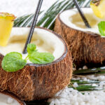 Closeup of pinacolada drink in the fresh coconut.