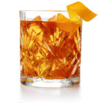 old fashioned cocktail garnished with orange twist peel isolated